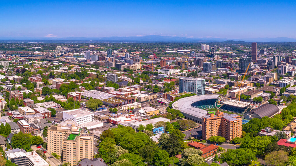 Aerial view of Portland, including Timber's soccer pitch and Mt. Hood in the distance